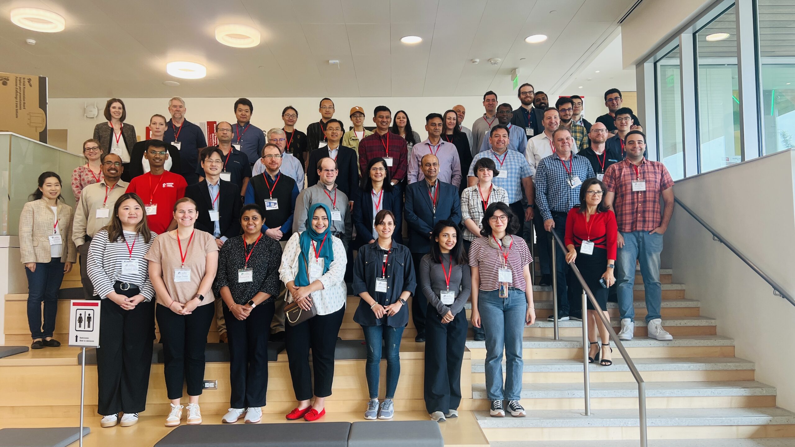 a group of workshop attendees pose for a photo